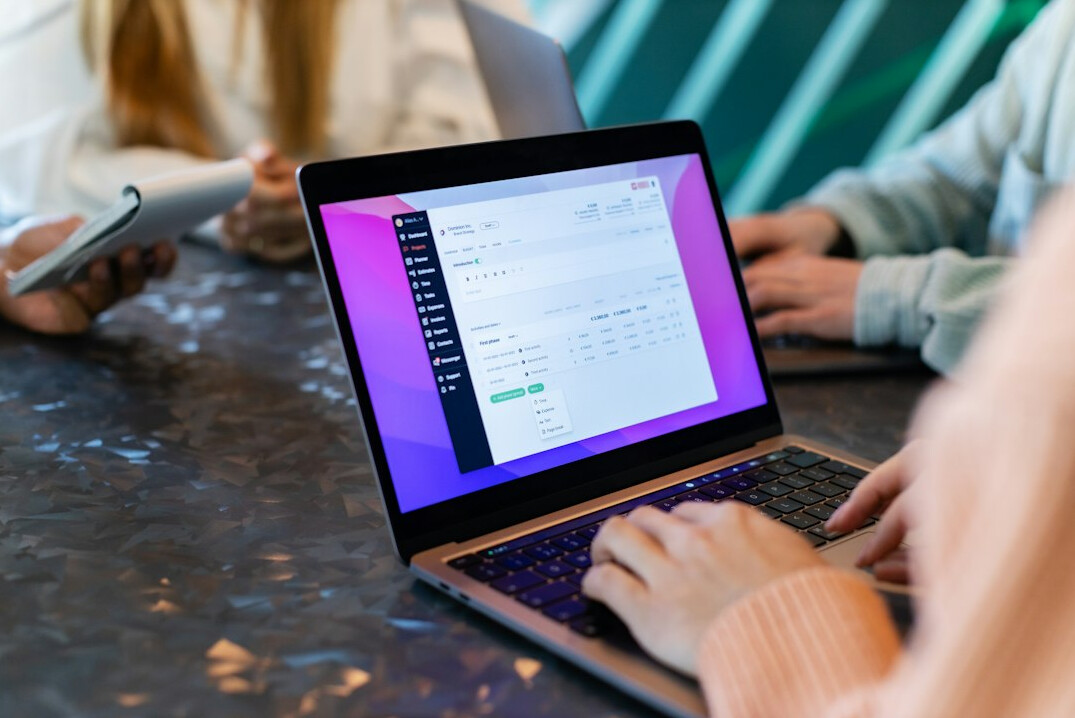 team analyzing data on laptop